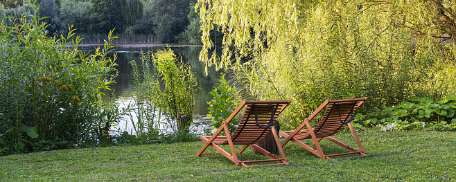 Relaxing wooden chairs Am Waldsee in Lehrte Lower Saxony in Germany