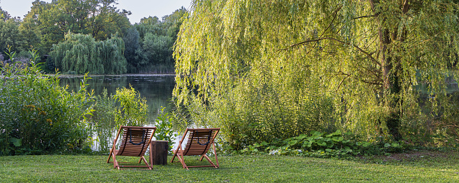 Relaxing wooden chairs Am Waldsee in Lehrte Lower Saxony in Germany