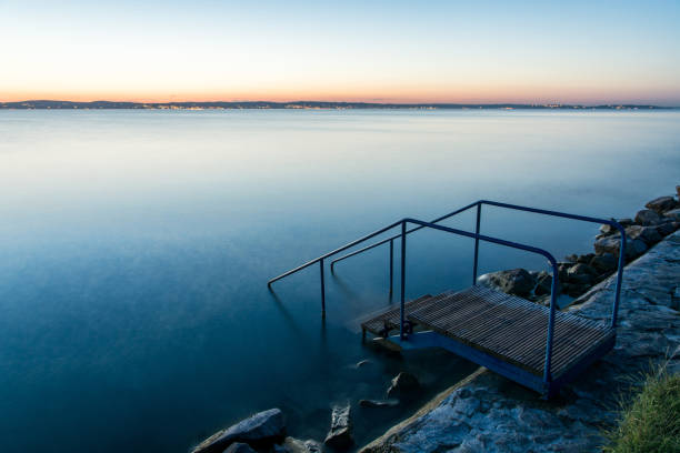 Jetty at sunset, on Balaton lake, Hungary