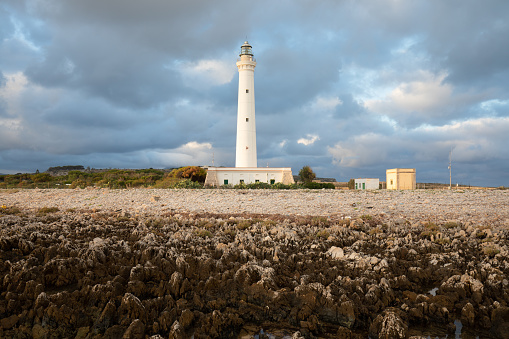 San Vito Lo Capo Lighthouse is an active lighthouse located on the west coast of Sicily near Trapani. Italy.\nA beautiful sunny day by the seashore. An active holiday.