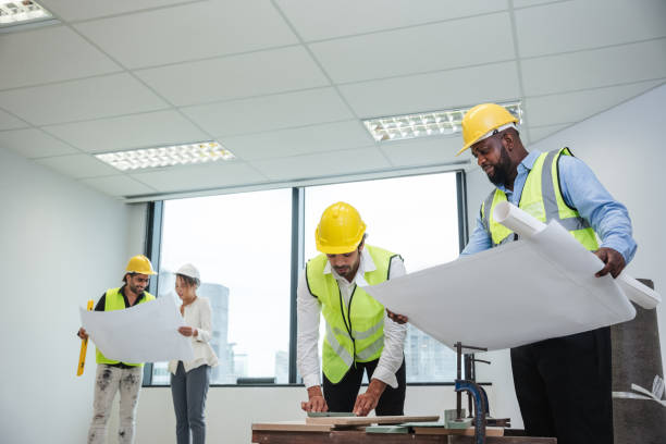 istock Engineers meet in the office to work on an architectural project as a team. Team of Professionals Engaged in Architectural Project Planning and Design. 1892416491