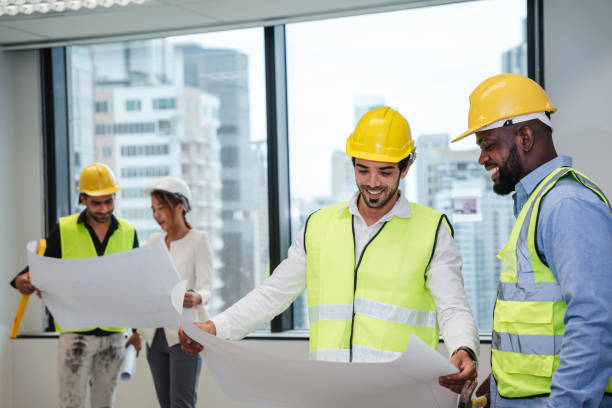 istock Engineers meet in the office to work on an architectural project as a team. Team of Professionals Engaged in Architectural Project Planning and Design. 1892419068