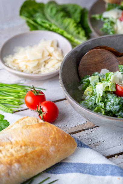 istock Green salad with tomatoes, bread and parmesan cheese 1892442010