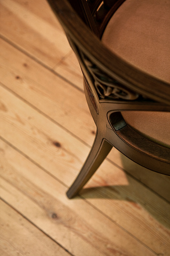 Wooden armchair on a wooden floor