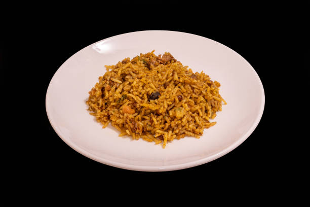 istock Sri Lankan biryani on a white plate against a black background 1892520847