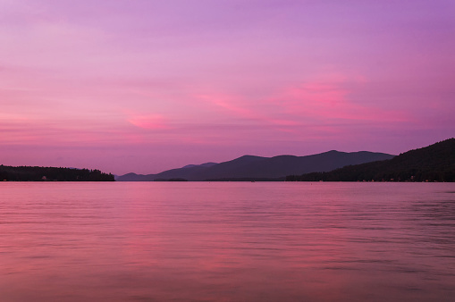 a colorful sunset on Lake George at dusk in New York.