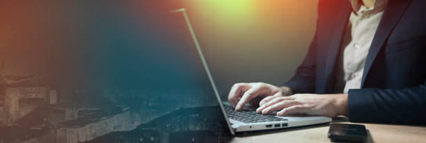 istock business man sitting in front of laptop working 1892544720