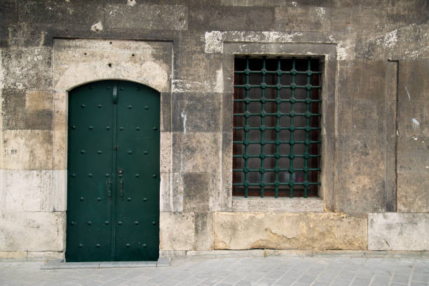 istock Green old door and window 1892553001