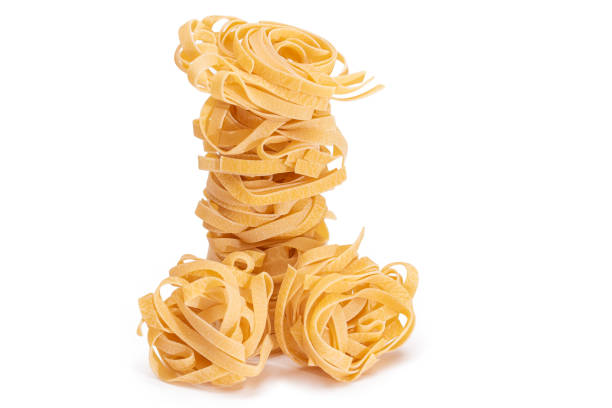 istock Classic Italian Raw Egg Fettuccine - Isolated on White Background 1892569112