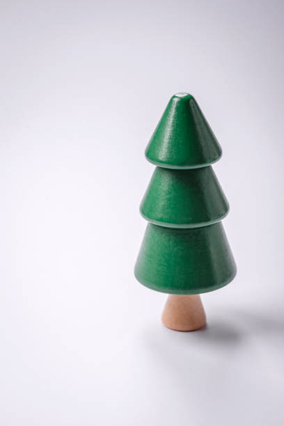 istock Wooden model of a tree with a green crown and trunk on a white background 1892608749