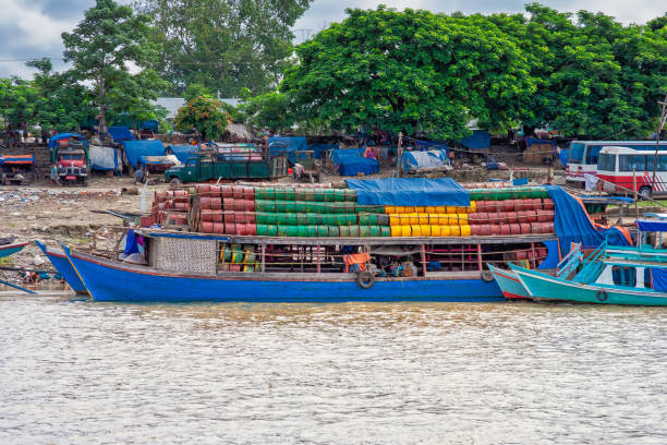 istock old ships loaded with colored oil barrels and a shore littered with plastic waste 1892614660