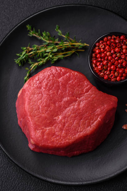 istock Fresh juicy raw filet mignon with salt, spices and herbs 1892652491