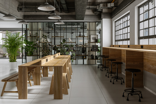 Modern Cafe Interior With Wooden Table, Seats, Bookshelf And Houseplants