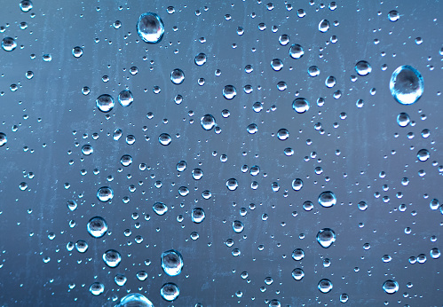 Blue Abstract Water Drops Background with reflection.