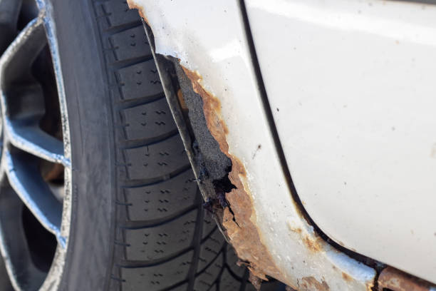 istock Rotten sills of an old gray car 1892744332
