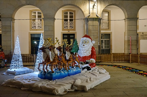 Figure of Santa Claus being carried by reindeer in the Plaza de Maria Pita, in the city of Coruna Coruna, Galicia, Spain 12152023