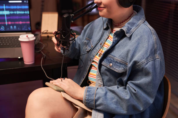 istock Smiling Female Guest in Podcast Room 1892779454