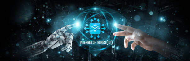istock Internet of Things, Hands of robot and human touch on IoT-enabled devices network, Brain data interconnected in IoT ecosystem, Connectivity and sensor technology, are innovations for smart living. 1892819295