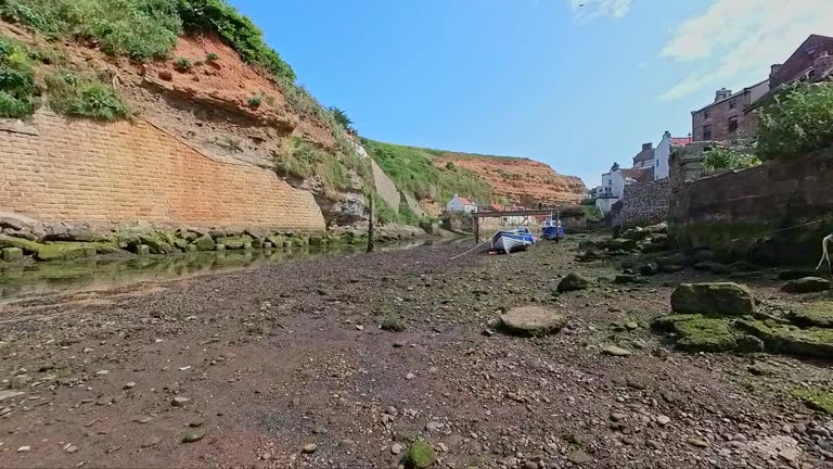 Beached boat in Staithes at low tide