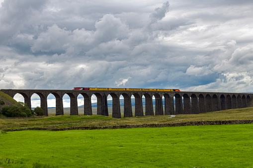 Diesel locomotive crossing on the Ribblehead Railway Viaduct in the Yorkshire Dales National Park, England.