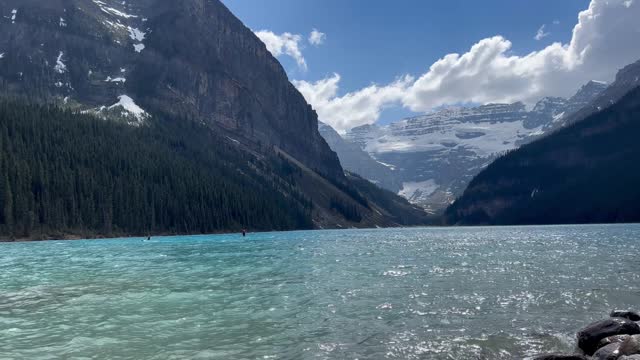 Paddleboarding in the distance at Lake Louise, Canada