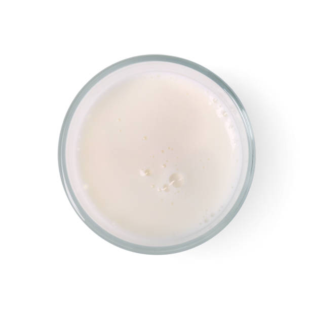 istock Glass of fresh milk isolated on white, top view 1892965196