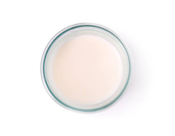 istock Glass of fresh milk isolated on white, top view 1892965704