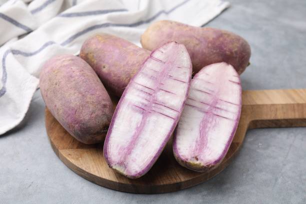 istock Purple daikon radishes on light grey table 1893097373