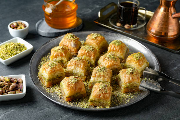istock Delicious fresh baklava with chopped nuts served on grey table. Eastern sweets 1893108271