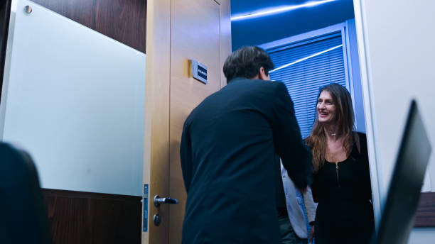 istock Salesperson receiving a customer 1893208057