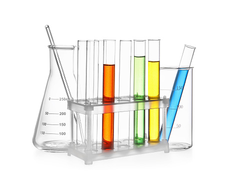 Glass flask, beaker and test tubes with colorful liquids isolated on white