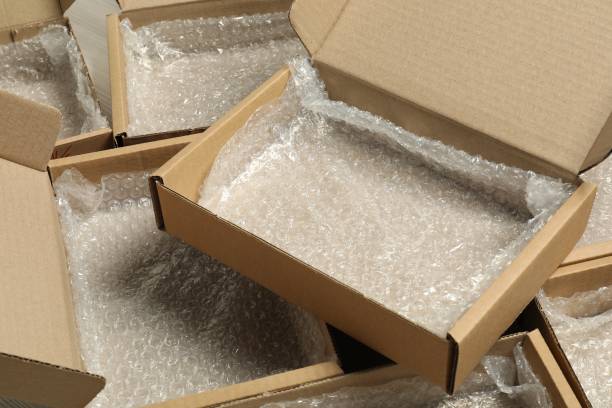 istock Many open cardboard boxes with bubble pack on floor, closeup. Packaging goods 1893242757