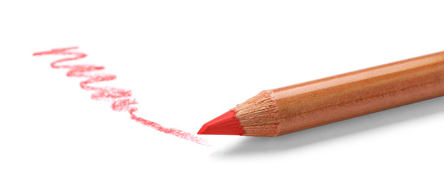Pink pastel pencil and scribble isolated on white. Drawing supply