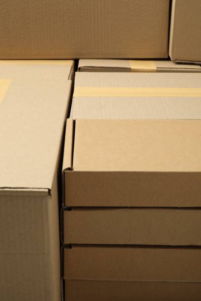 istock Many cardboard boxes as background, closeup. Packaging goods 1893245344