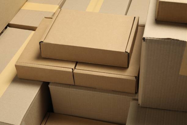 istock Many cardboard boxes as background, closeup. Packaging goods 1893245346