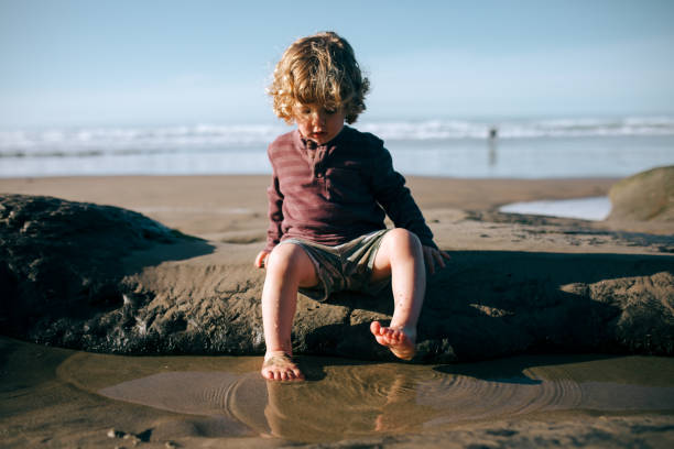 istock Boy Playing At Oregon State Pacific Ocean Beach 1893252200