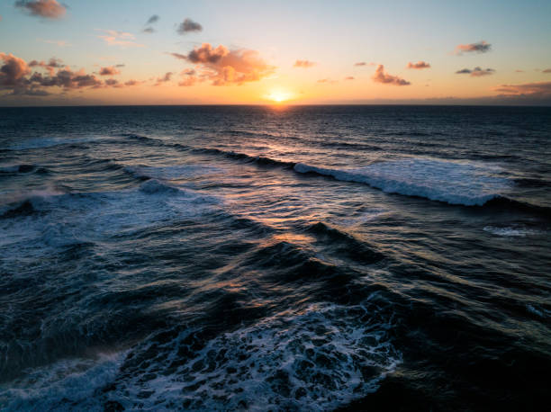 Beautiful sunset or sunrise in the island of Hawaii by the ocean with bright colors