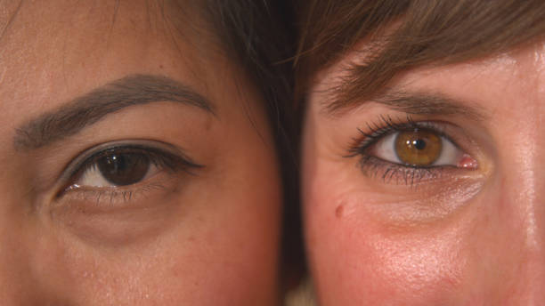 istock CLOSE UP, PORTRAIT: Detailed view of two young women's brown eyes side by side 1893270042