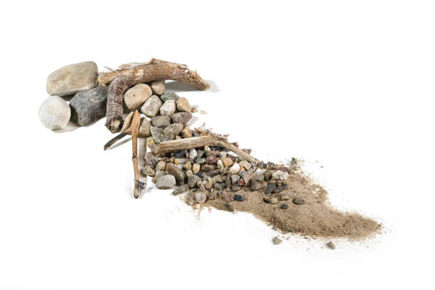 selection of rocks laying on grey sand