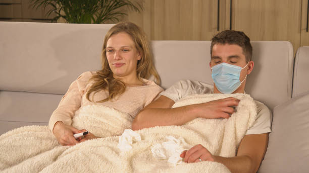 istock CLOSE UP: Guy wearing protective face mask to avoid spreading covid to his lady 1893353732