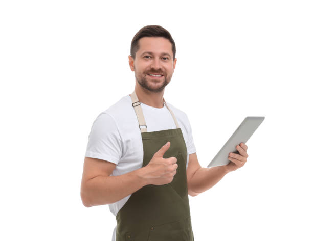 istock Smiling man with tablet showing thumb up on white background 1893371086