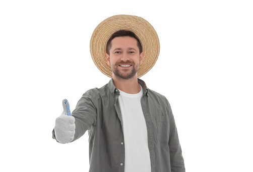 Harvesting season. Happy farmer showing thumb up on white background