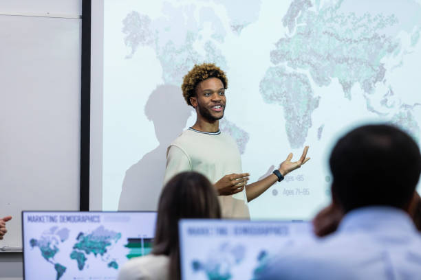 istock Young male college student presents to classmates 1893496047