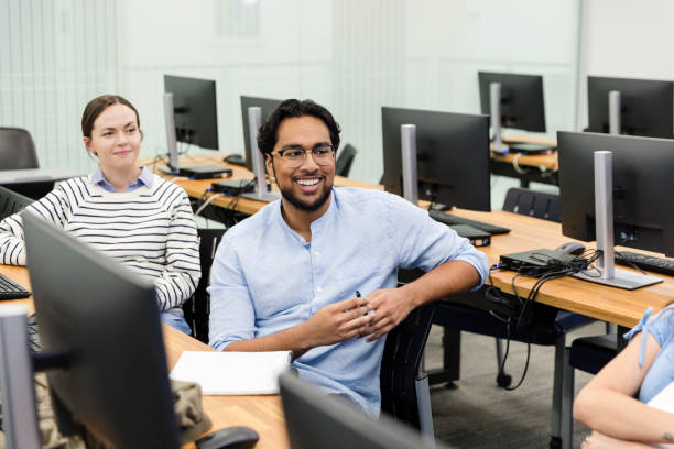 istock Two diverse university students talk with unseen friend 1893496087