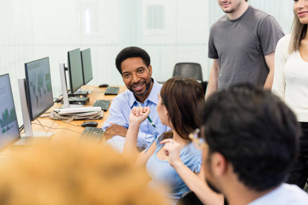 istock Multiracial group of college students brainstorm project ideas 1893496610