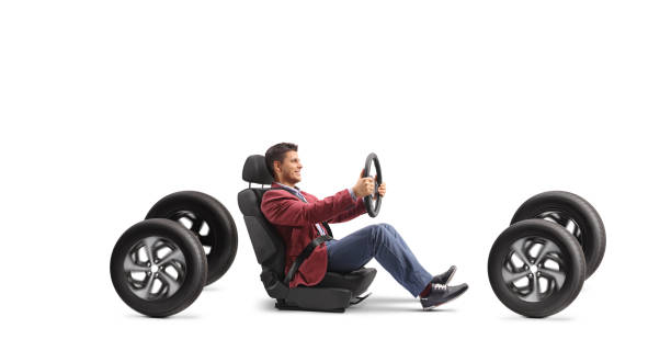 Man in a car seat driving on four tires