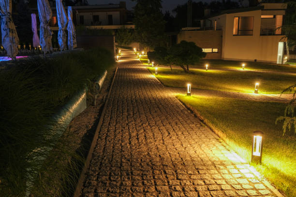 alley, stone path in a country residence illuminated by street lamps. - formal garden tropical climate park plant imagens e fotografias de stock