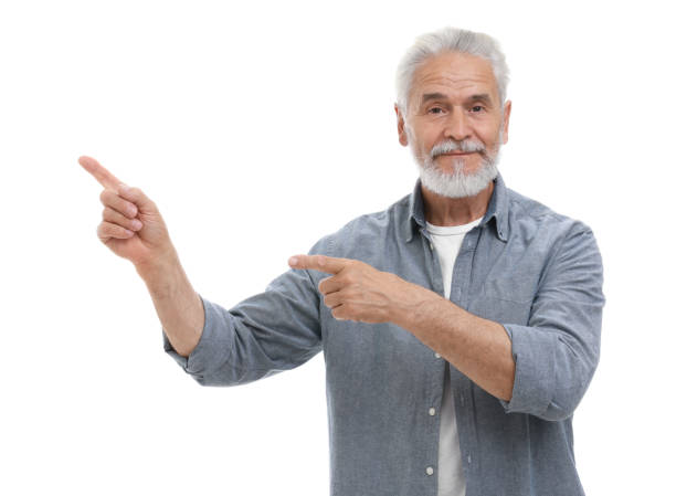 istock Special promotion. Senior man pointing at something on white background 1893508254