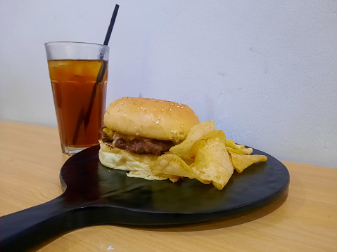 Encore Burger With Potato Chip And Tea Cool. Food And Drink Menu