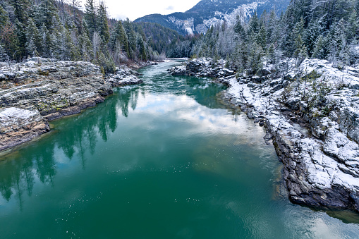The Middle Fork Flathead River is a 92-mile river in western Montana, forming the southwestern boundary of Glacier National Park. The water was a beautiful green color in this scenic December photo.